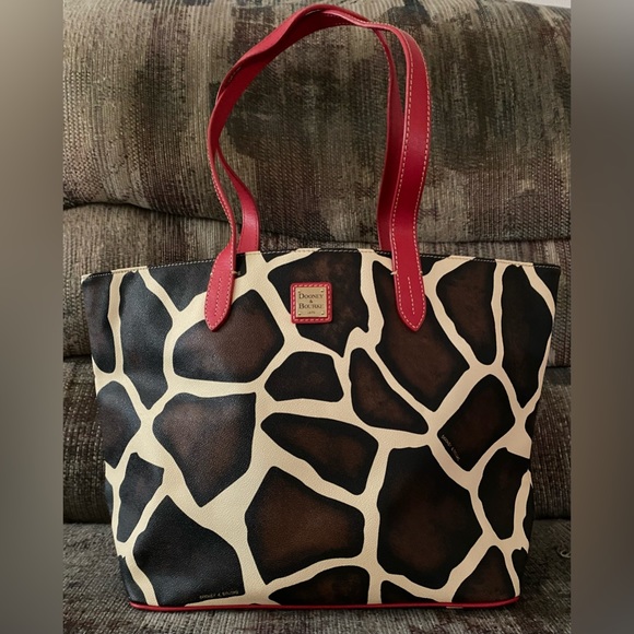 Dooney & Bourke Handbags - Dooney & Bourke giraffe print tote with red strap.